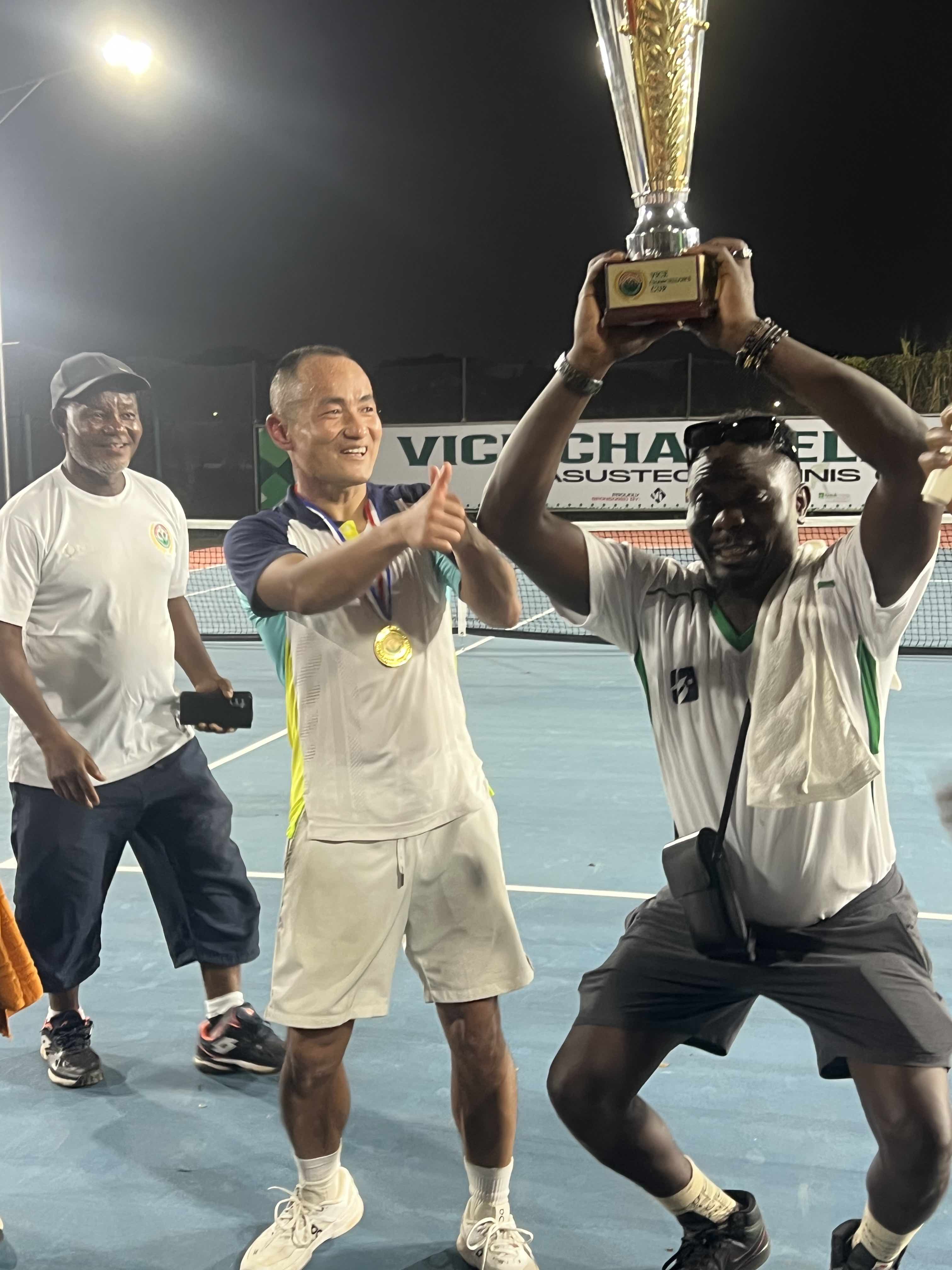 Happy athletic man having paddle tennis exercise class on the court.